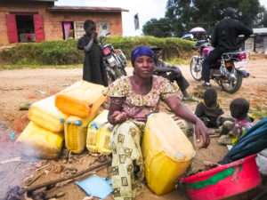 Widow Fights Sexism, Earns Respect and Pride Repairing Water Jugs in DRC